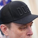 Tesla CEO Elon Musk, with a visible black eye, listens as U.S. President Donald Trump speaks to reporters in the Oval Office of the White House on May 30, 2025